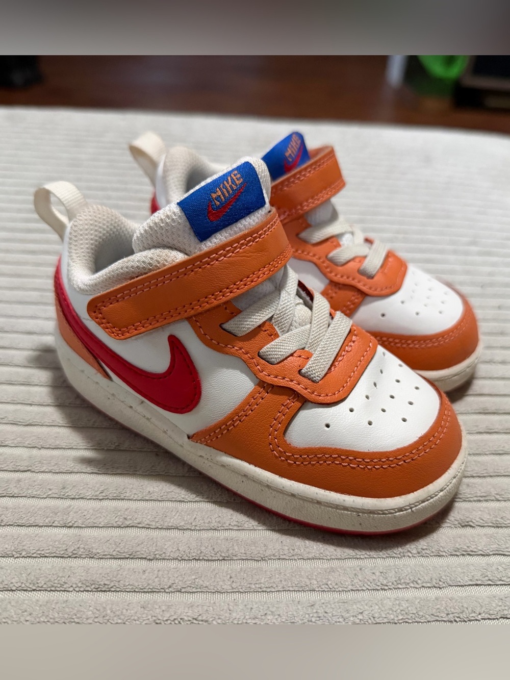 Nike Kids Orange & Red Low-Top Sneakers with Blue Logo Tab